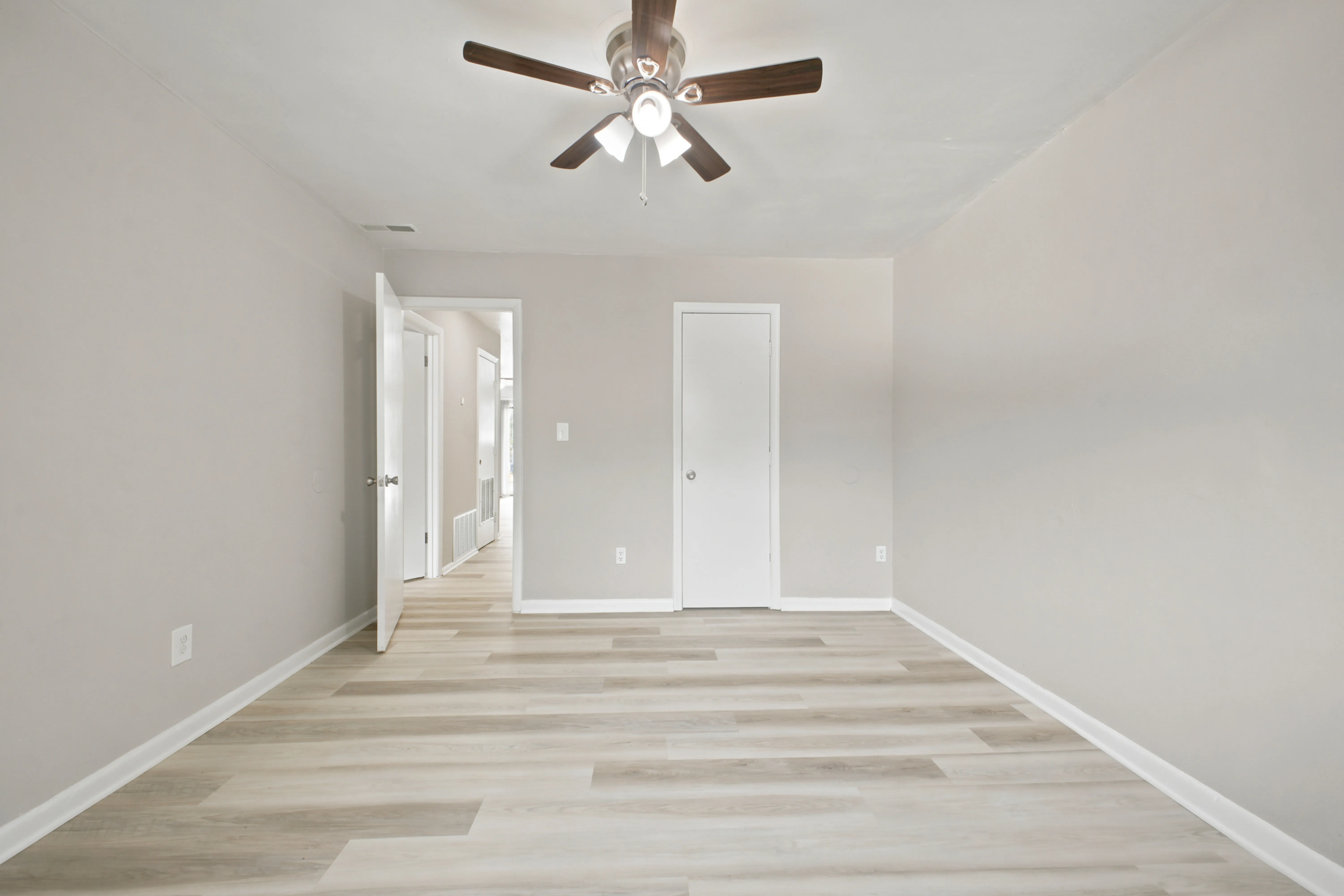 Bedroom with closet and doorway to the hall