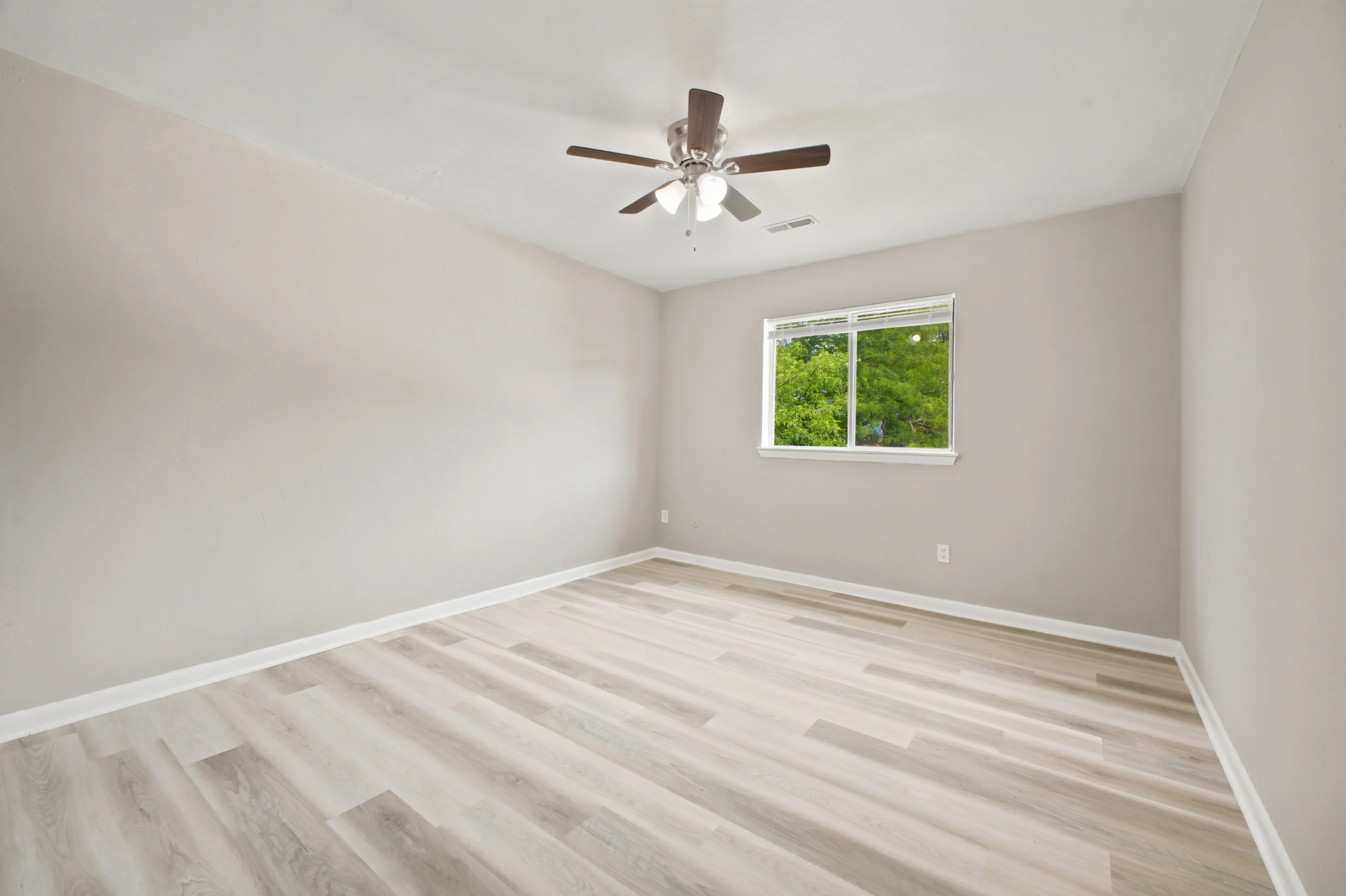 Bedroom with a window and ceiling fan